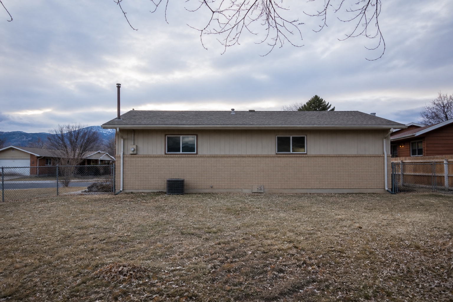 Backyard of a 1970s Aurora ranch before the addition was framed