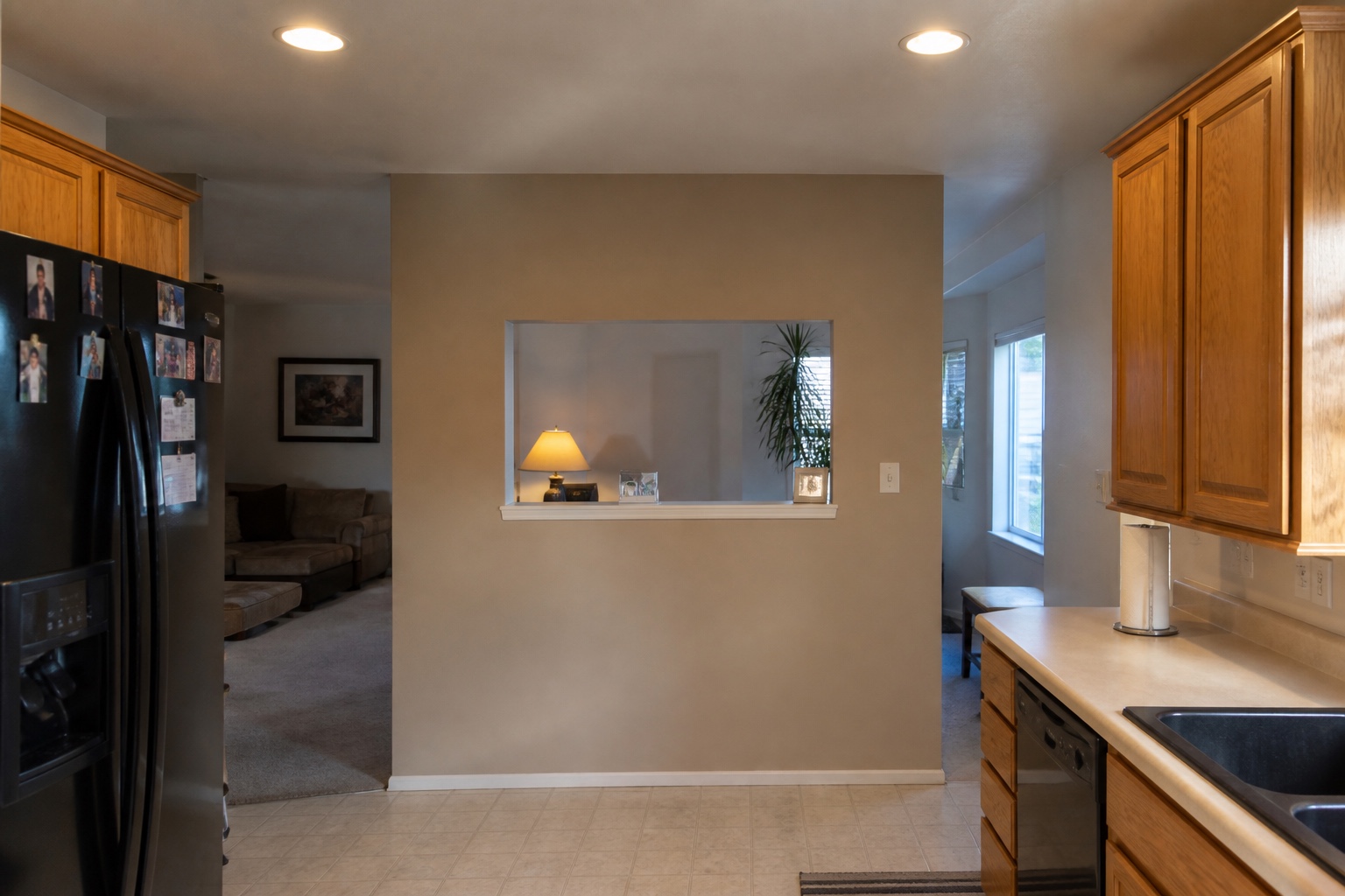 Kitchen closed off from the living room by a load-bearing wall